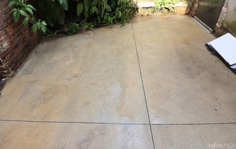 Clean concrete patio after pressure washing